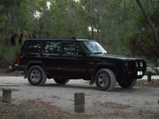 Jeep Cherokee XJ Sport 4WD 1995 with camping gear